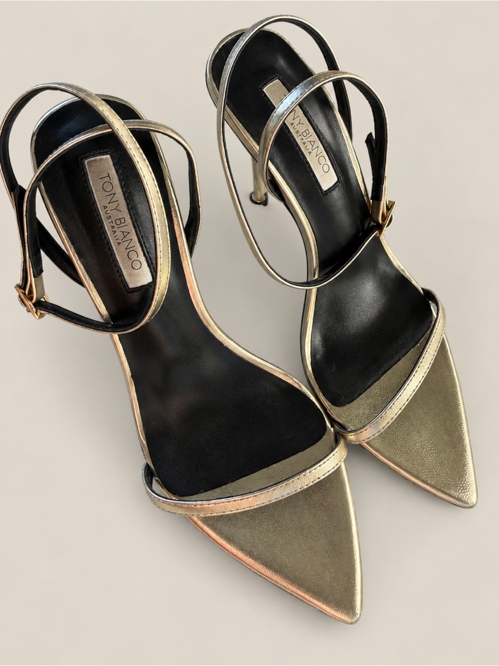 Tony Bianco metallic gold pointed-toe strappy stiletto heels in women’s size 7.5